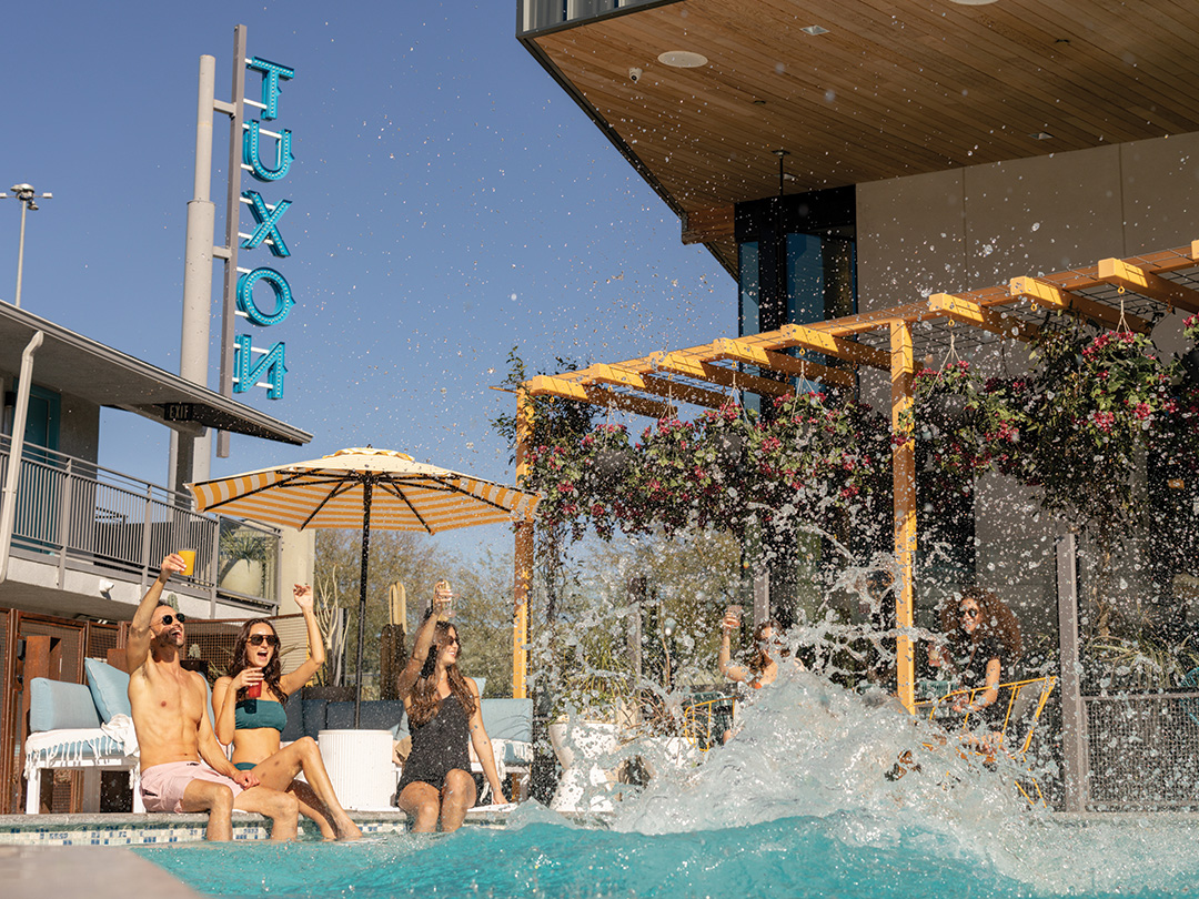 a group of people sitting in a pool