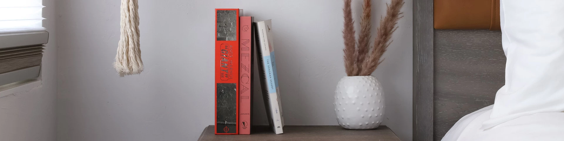 a vase with books in it
