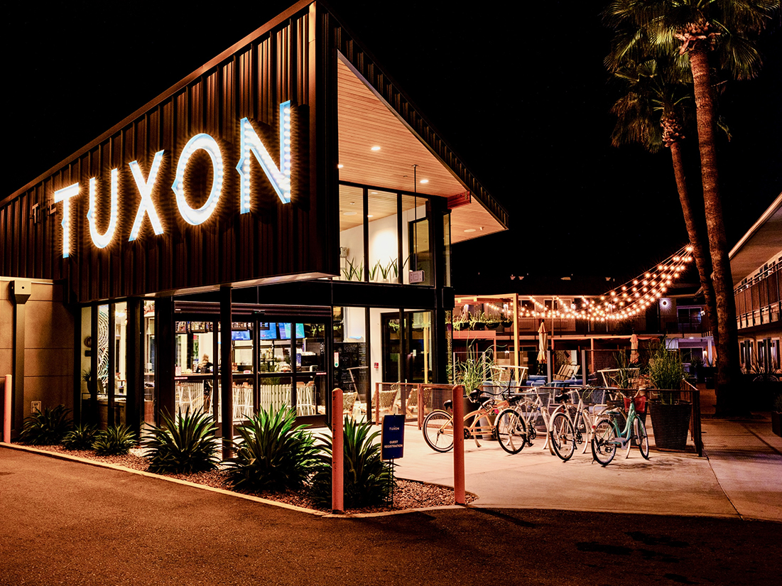 a building with a sign and bicycles parked in front of it