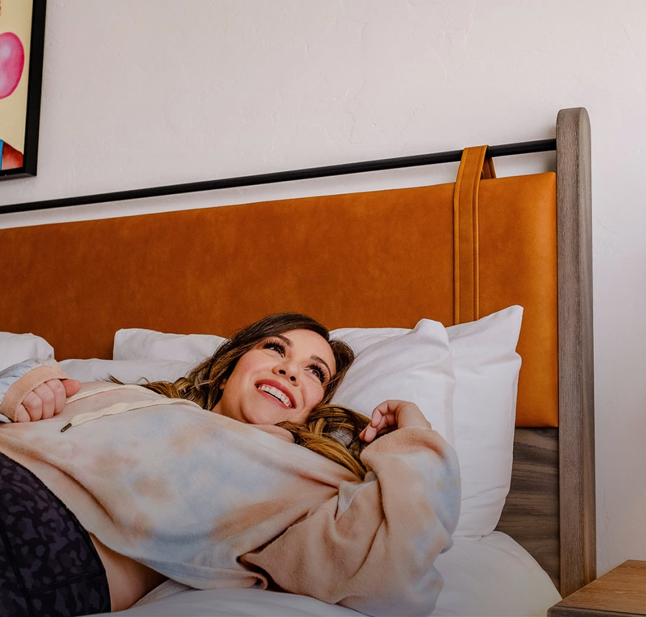 a woman lying on a bed
