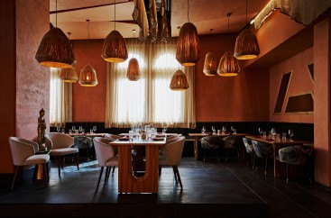 a room with tables and chairs and lamps