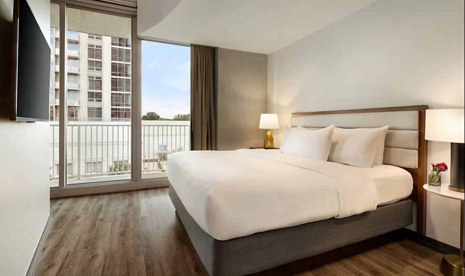 room with bed and a balcony