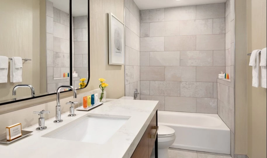 bathroom with one sink and a bathtum
