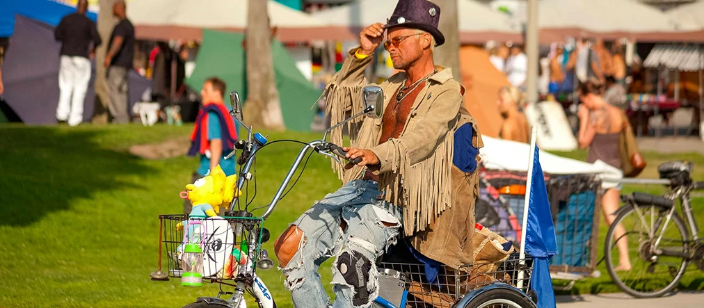 man riding his bike outside in the sun light