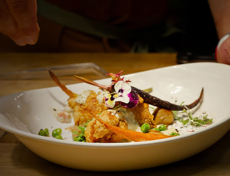 a plate of food with a flower on it