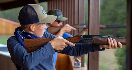 a boy holding a gun