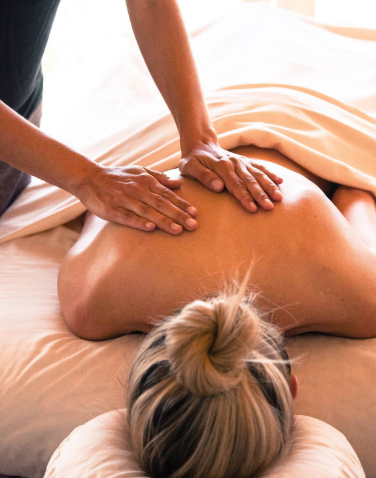 a person receiving a back massage