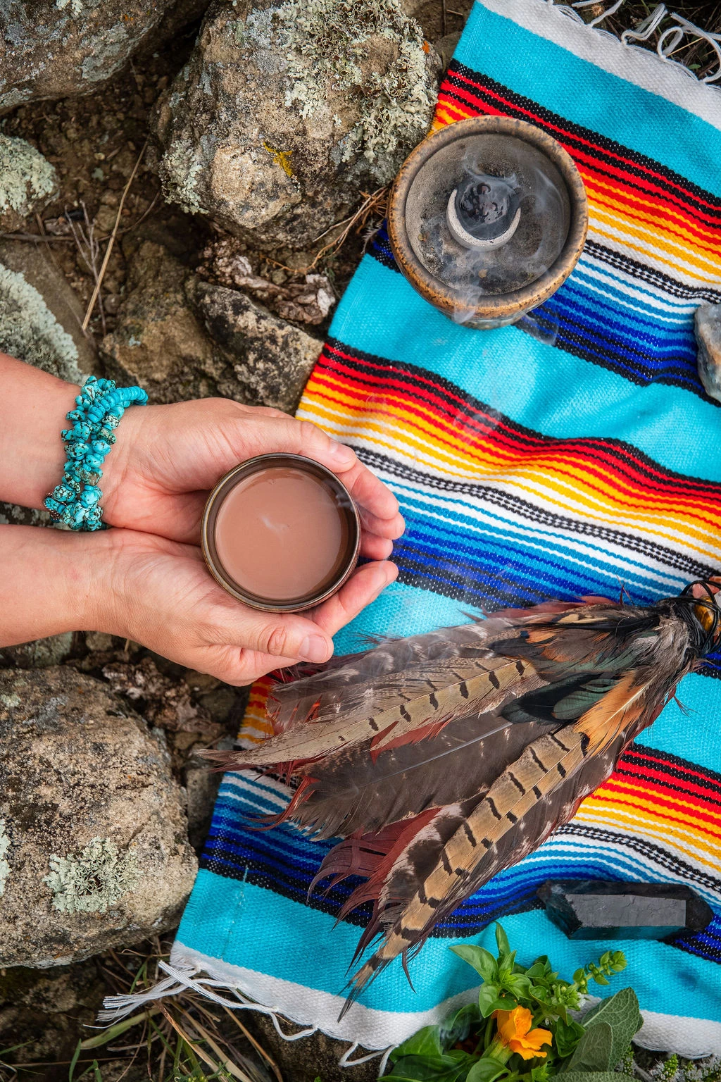 a person holding a cup of liquid