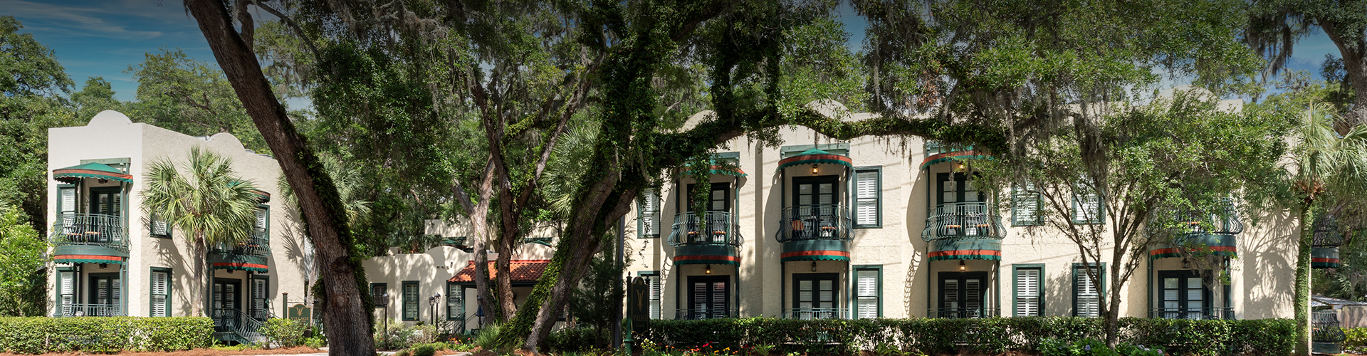 a building with trees and plants