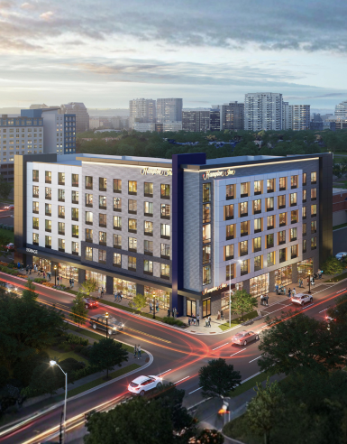 a building with many windows and a street in the background