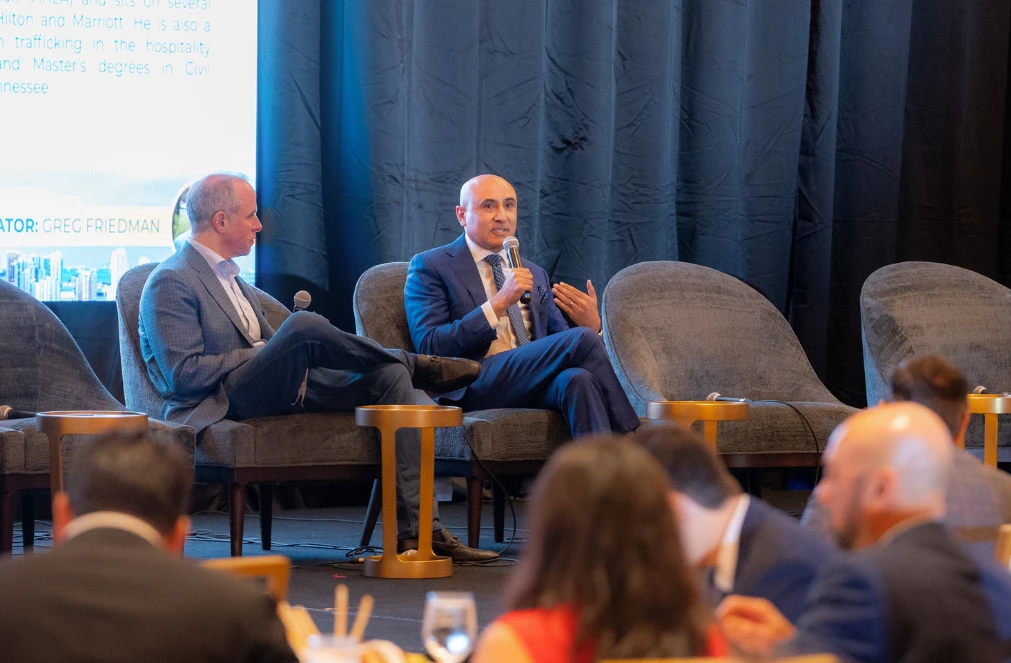 two men sitting in chairs
