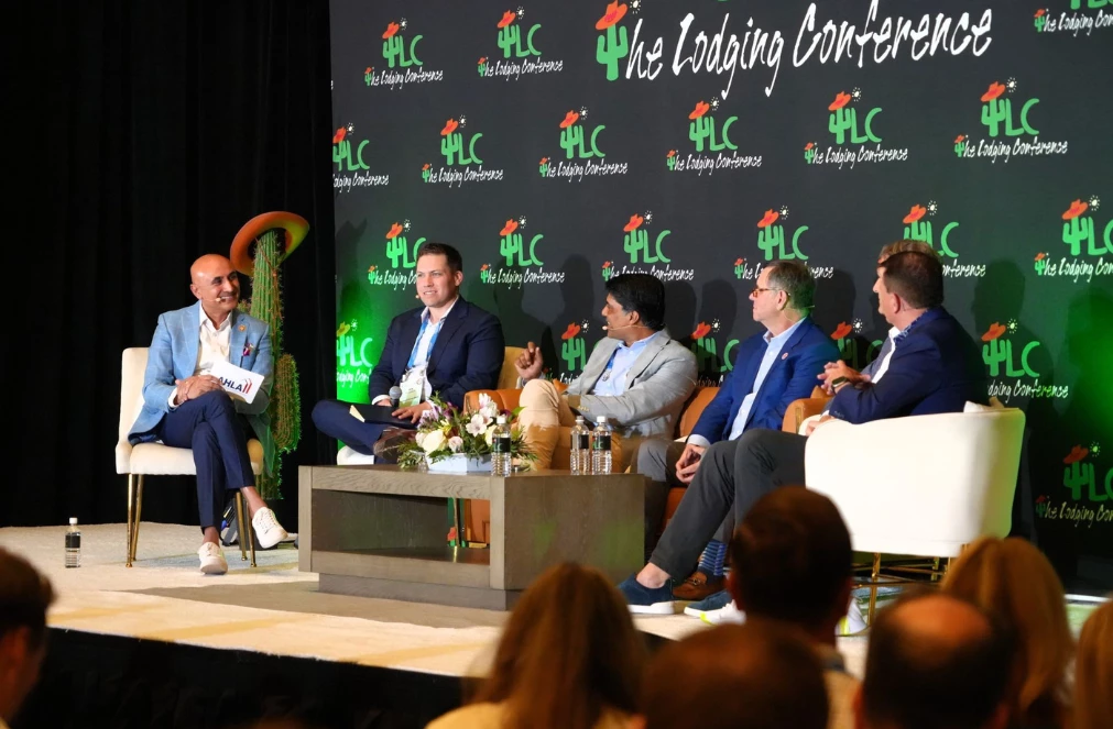 a group of men sitting on a stage