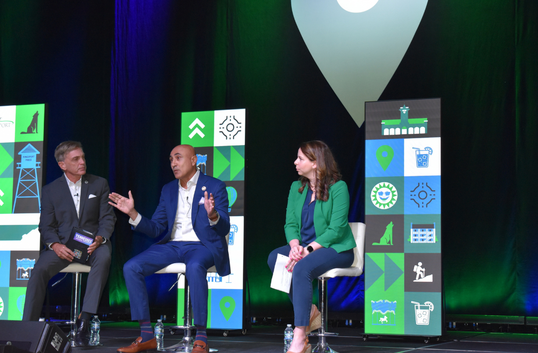 a group of people sitting on a stage