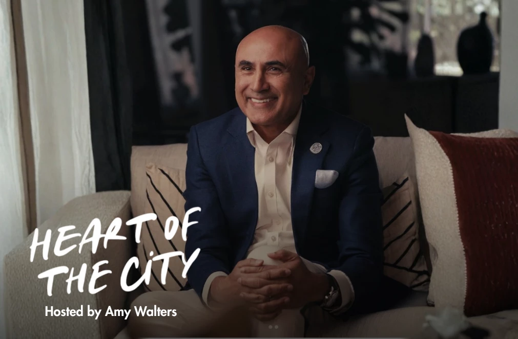 a man sitting on a couch smiling