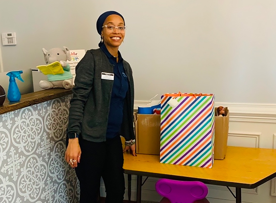 a woman posing with gifts