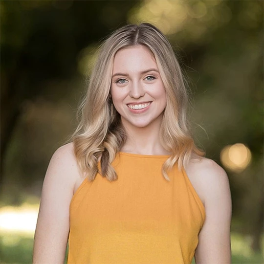 a woman smiling at camera