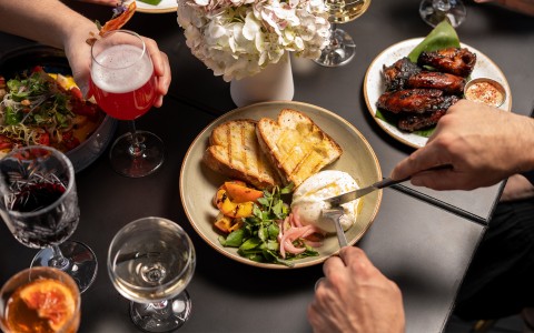 a person eating food on a table