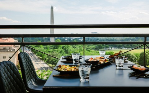 a table with plates of food and glasses on it