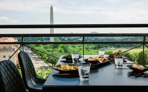 a table with plates of food and glasses on it