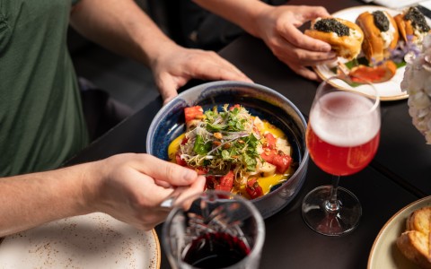 a person holding a bowl of food