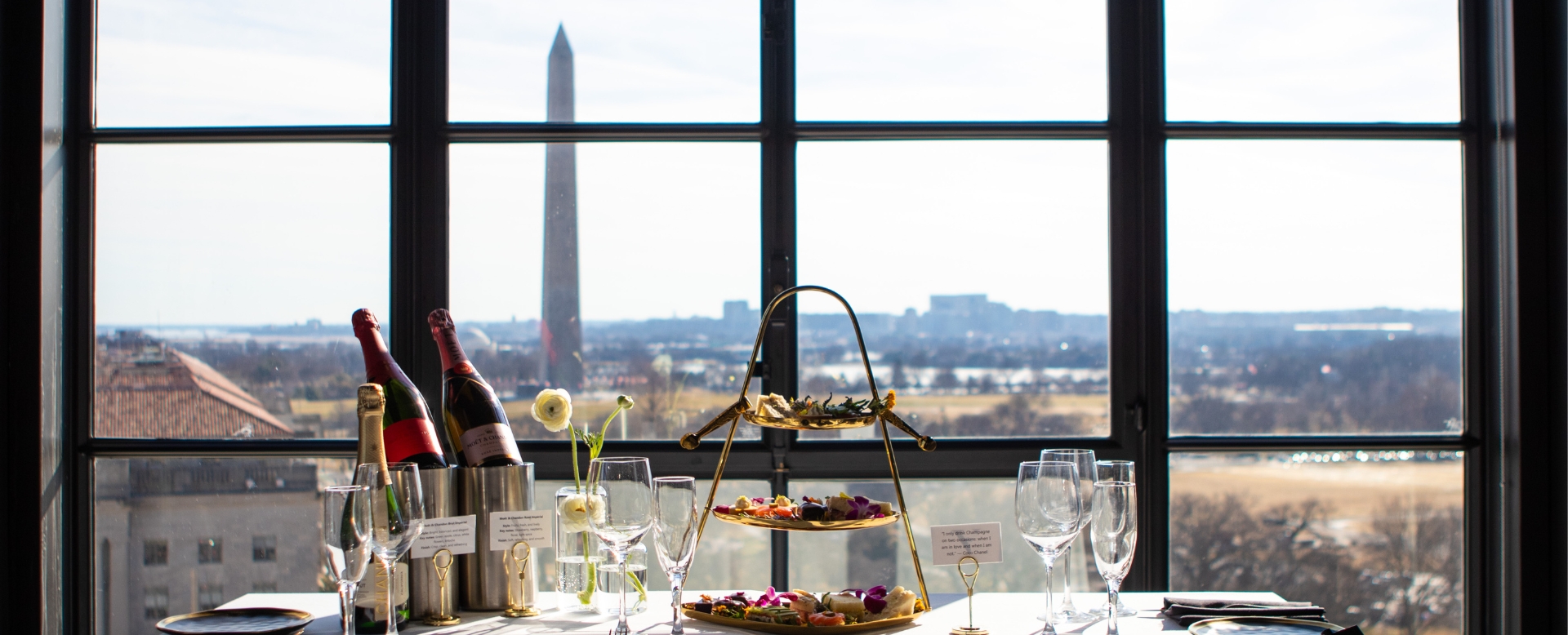 a table with wine glasses and food on it