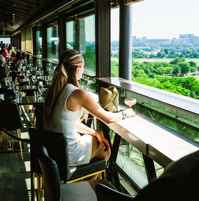 a woman sitting at a bar