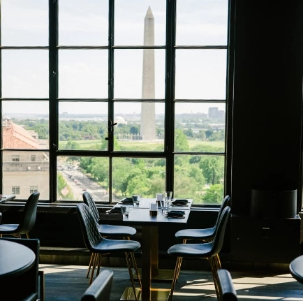 a room with a large window and a monument