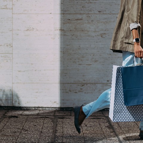 a man holding shopping bags