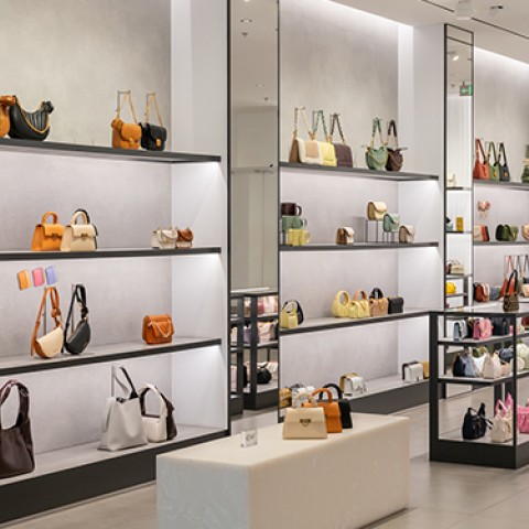 a display of purses and bags