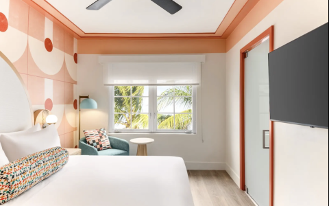 a room with a bed and a window