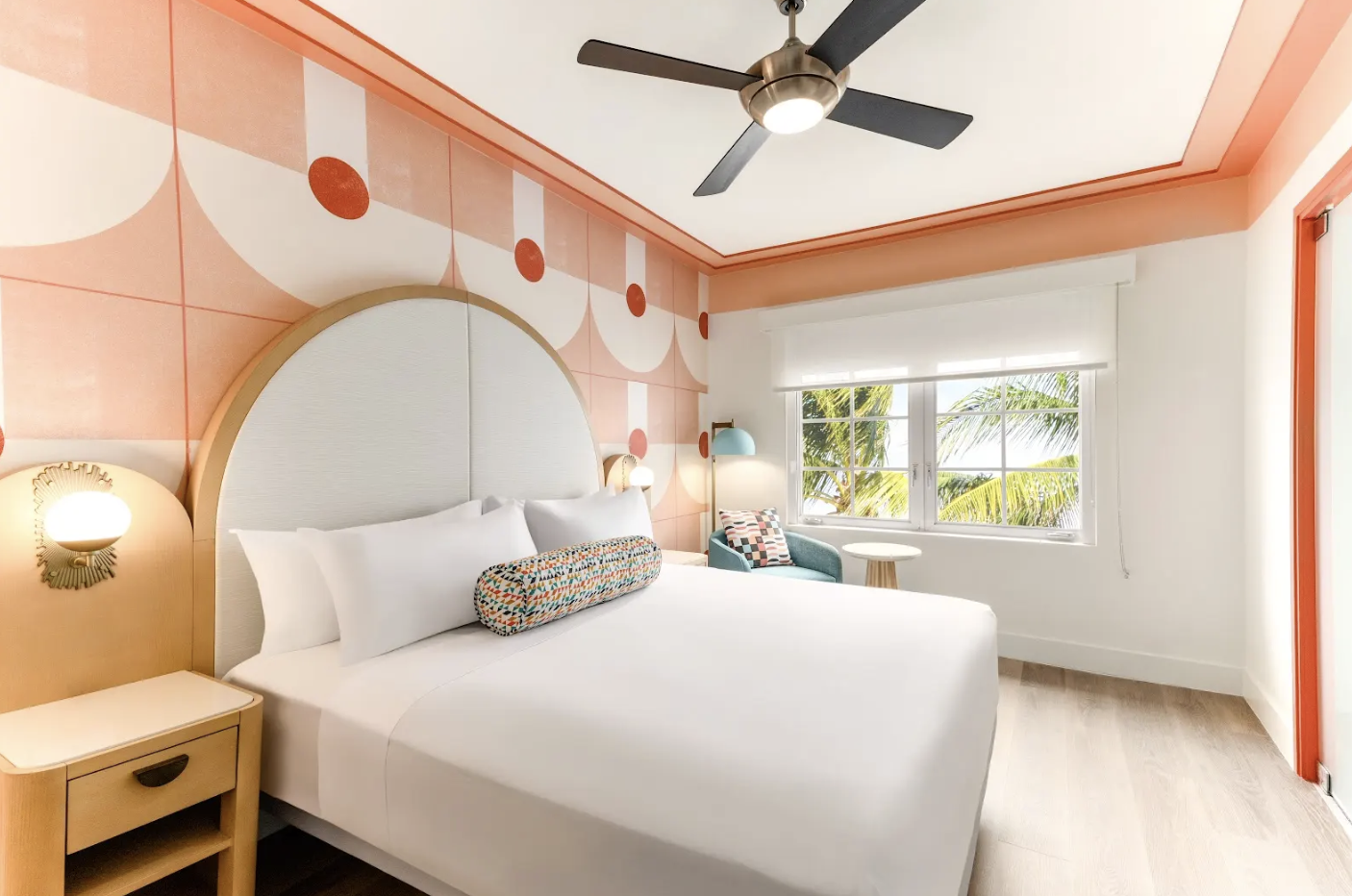 a room with a bed and a fan