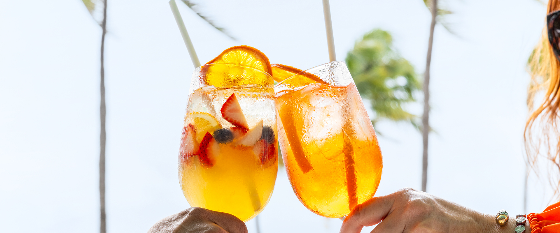 two glasses of orange and fruit juice