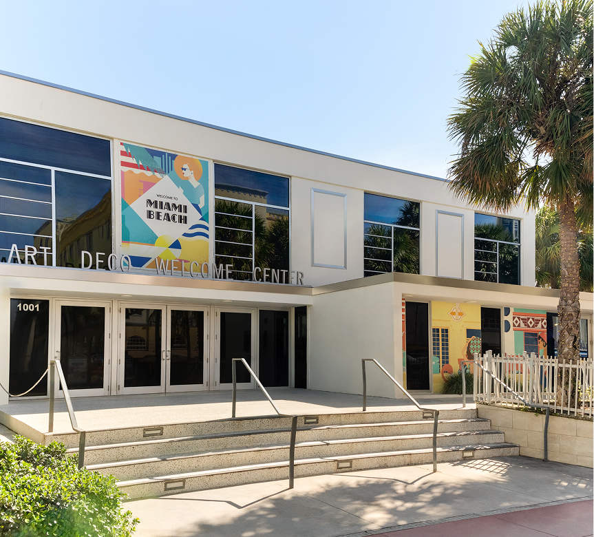 a building with stairs and palm trees