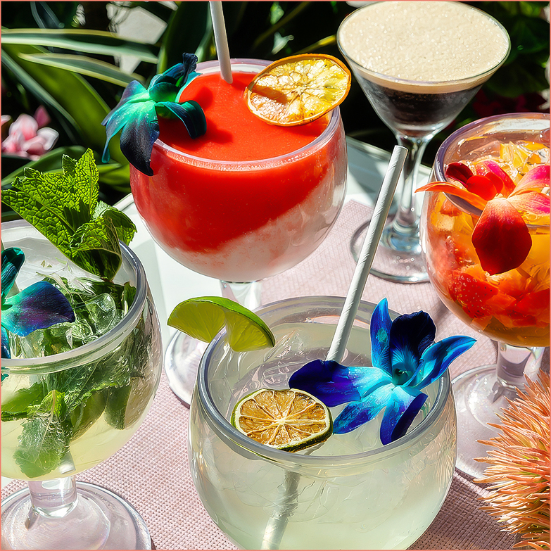 a group of drinks with flowers in them