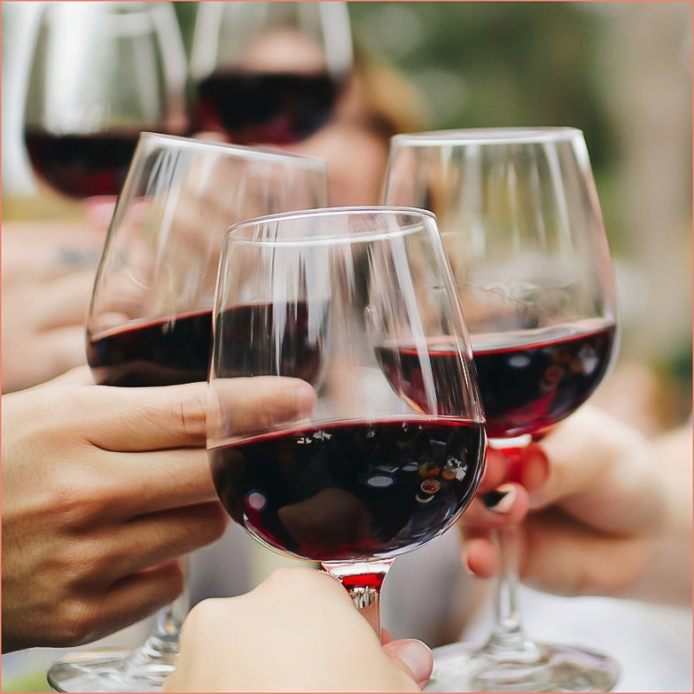 a group of people holding wine glasses