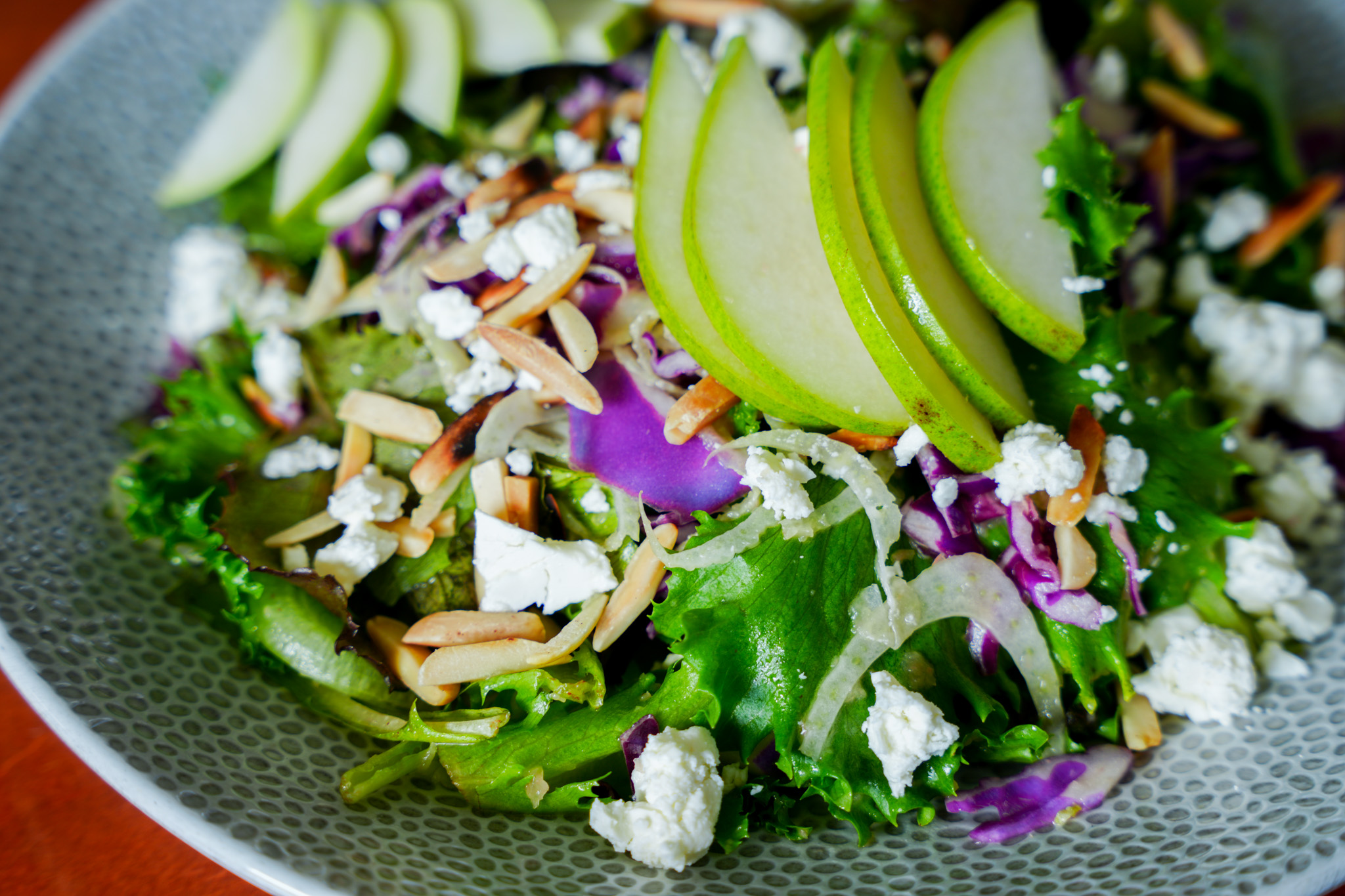 a salad with apples and cheese