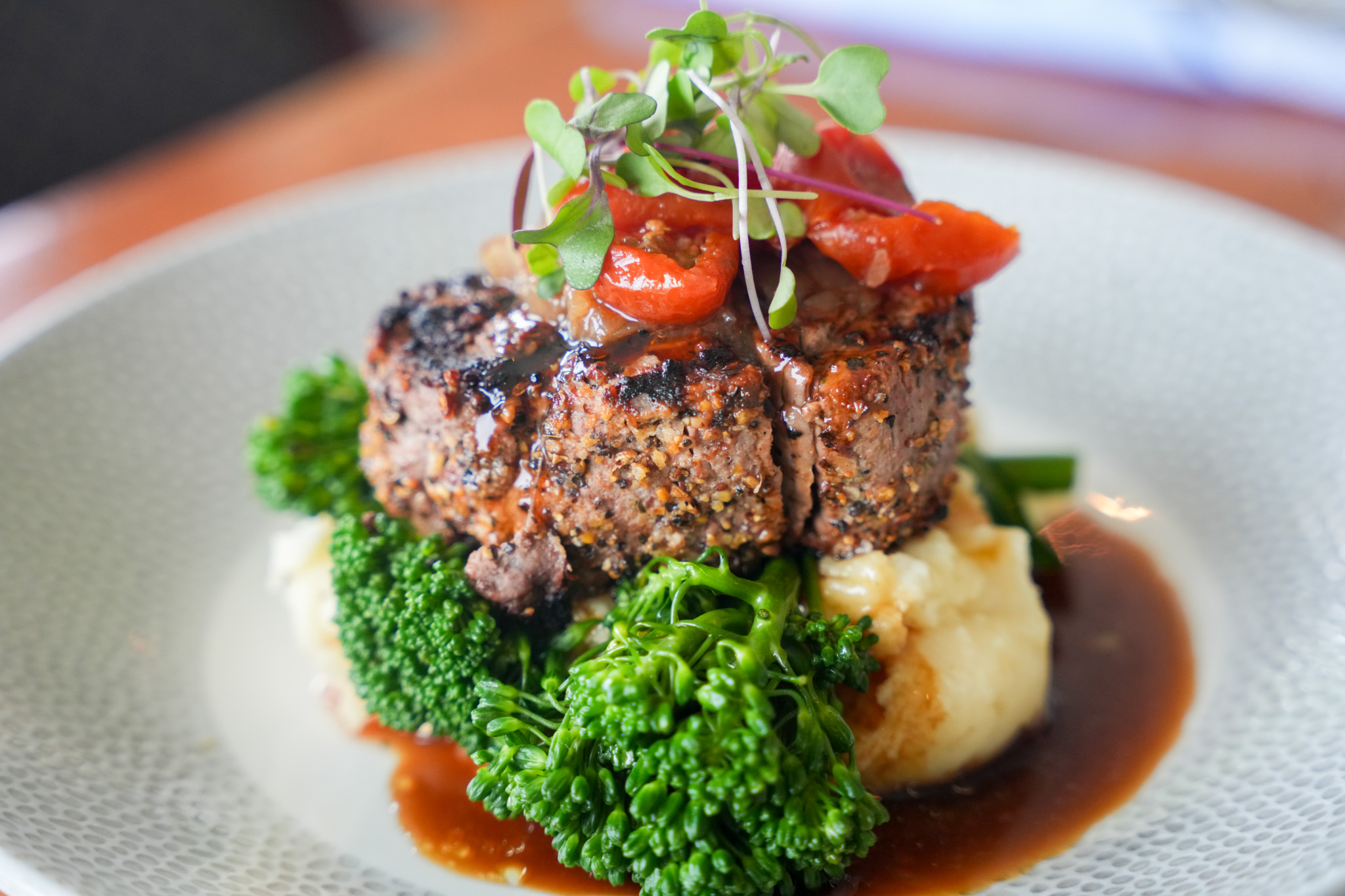 a plate of food with broccoli and meat