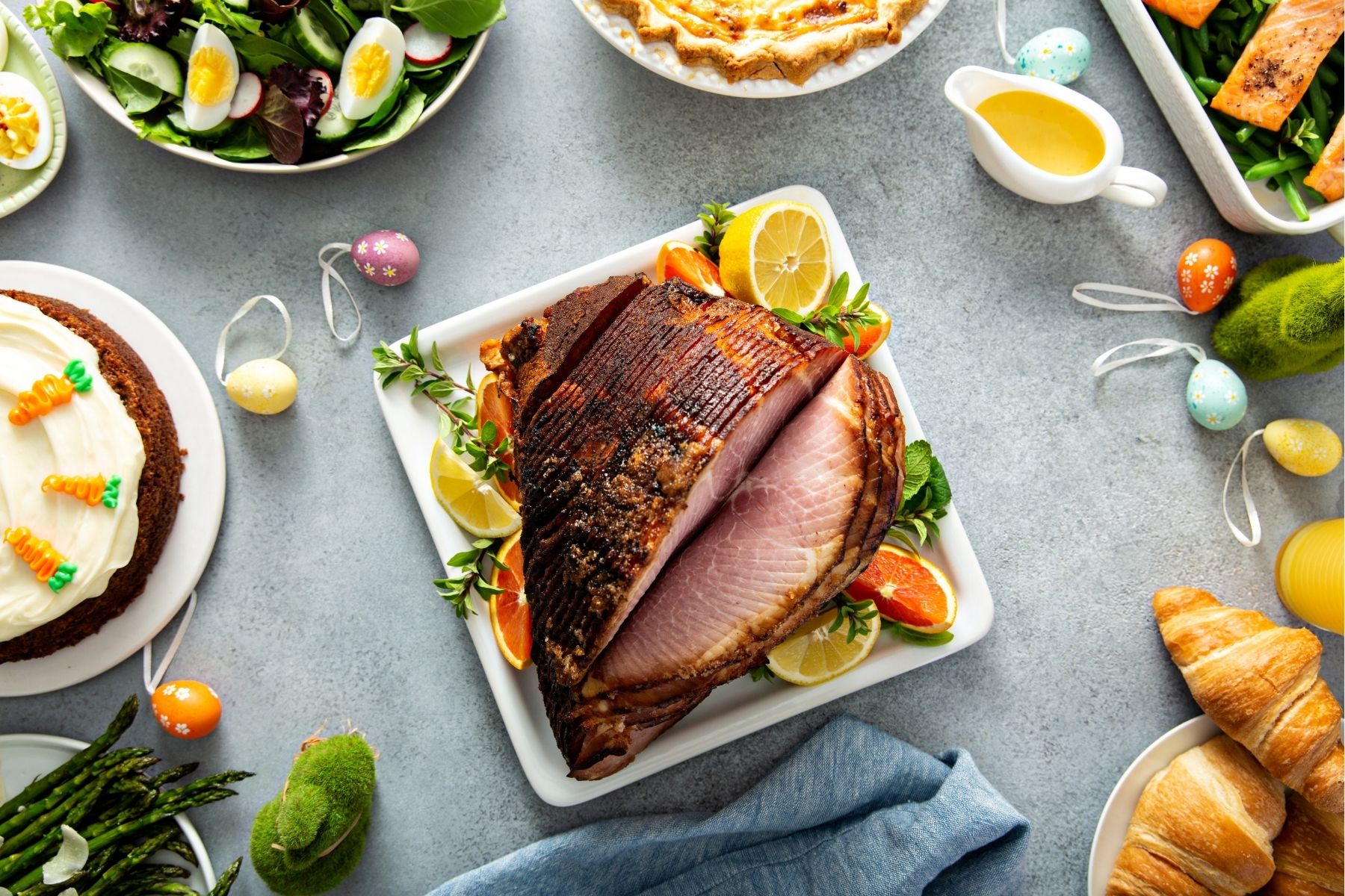 a ham on a plate with food on it