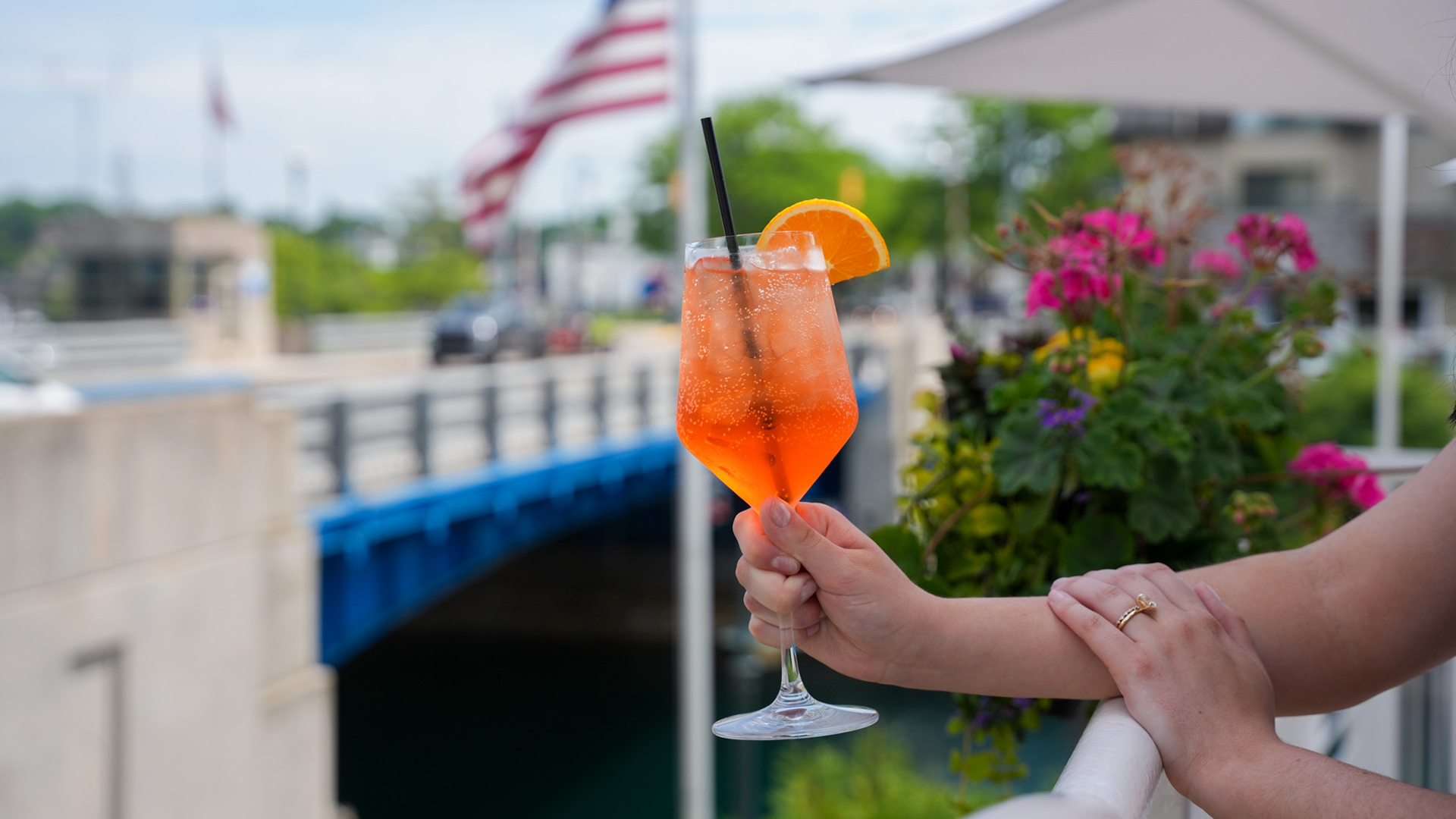 a hand holding a drink