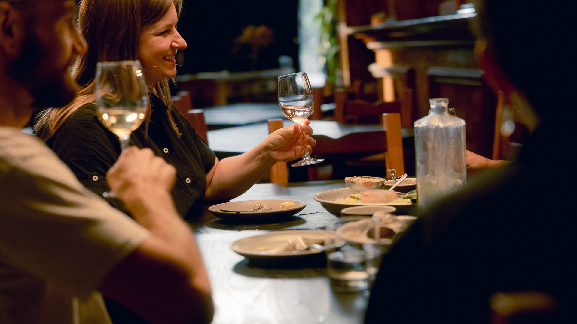 a woman holding a wine glass