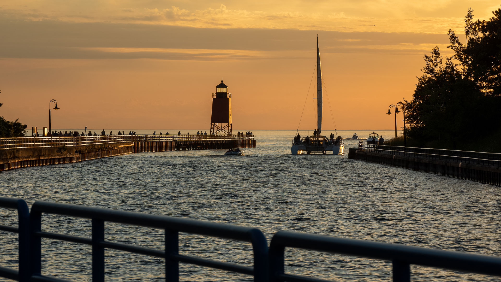 a body of water with a pier and a boat on it