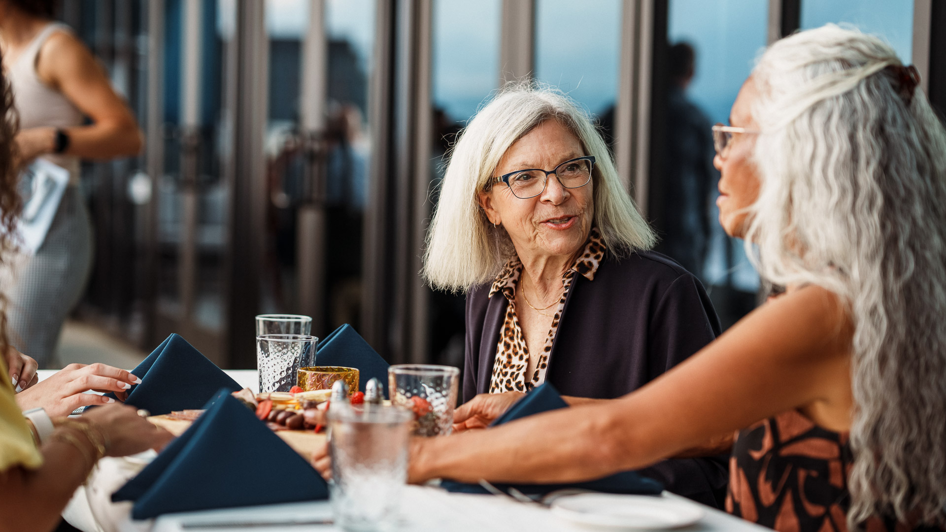 a group of women sitting at a table