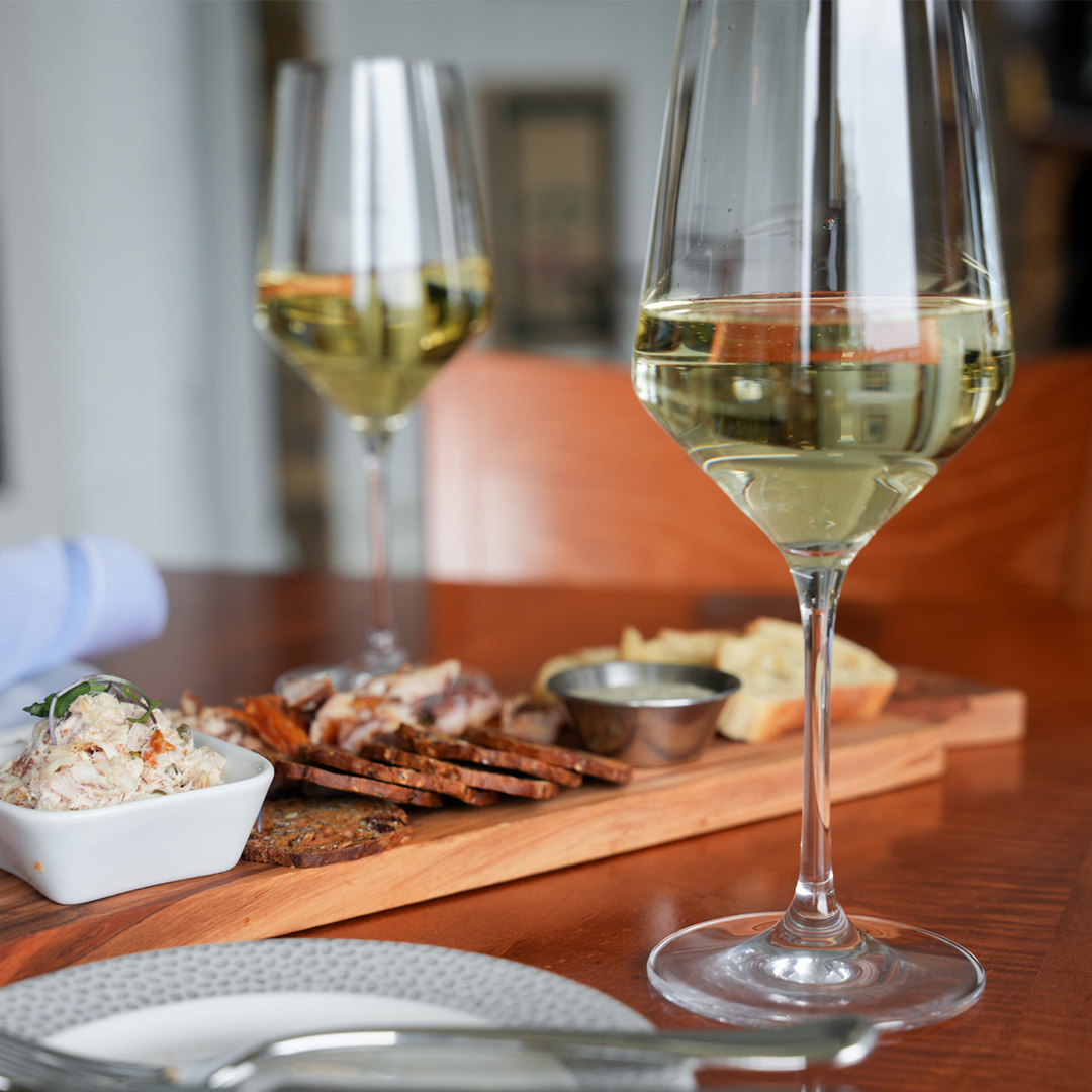 a glass of wine on a table