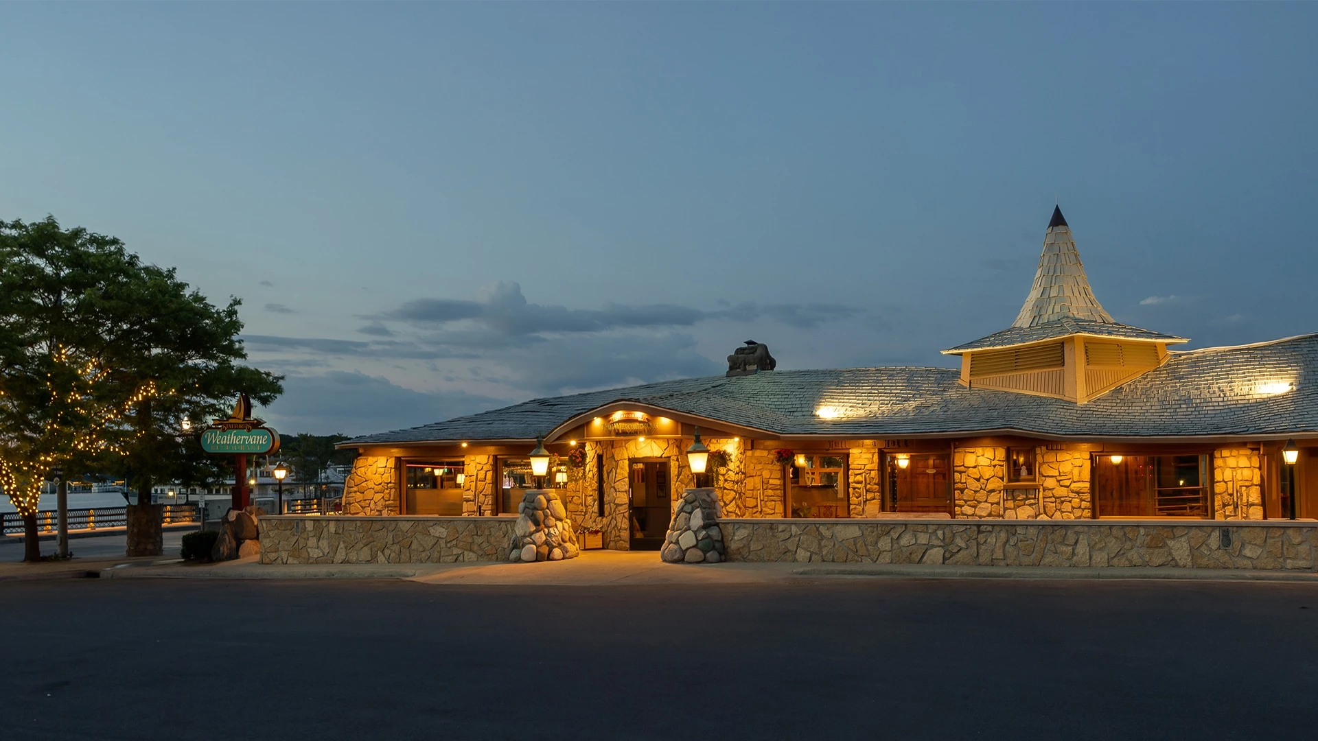 a building with a stone wall and a stone wall