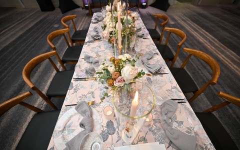 a table with candles and flowers