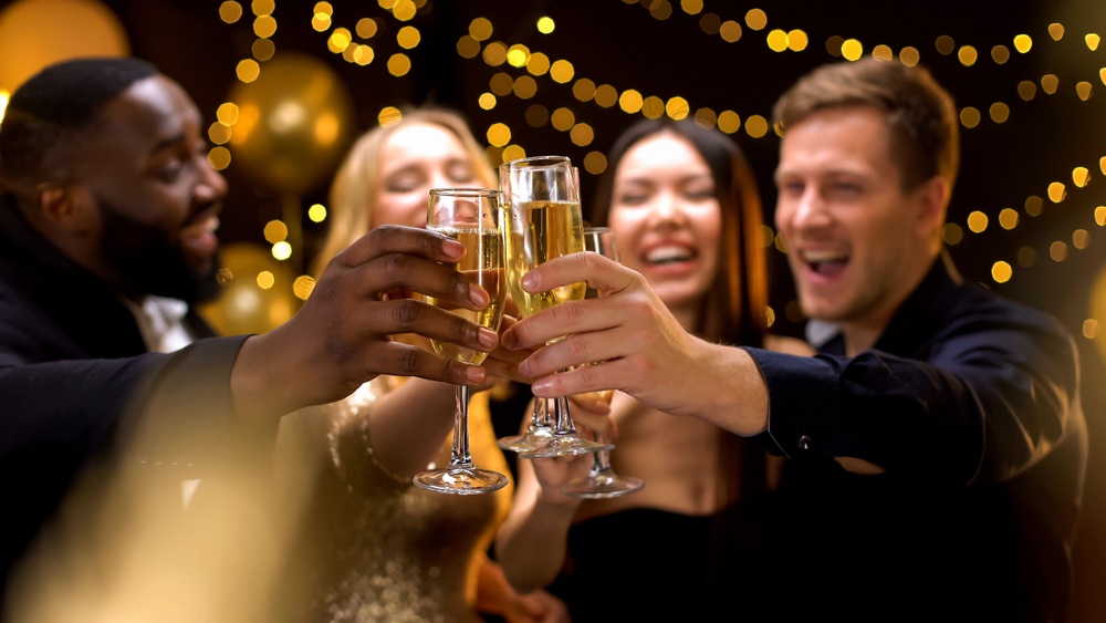 a group of people holding glasses of champagne