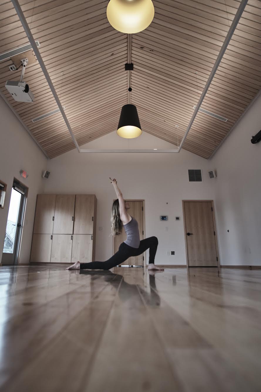 a woman doing yoga in a room