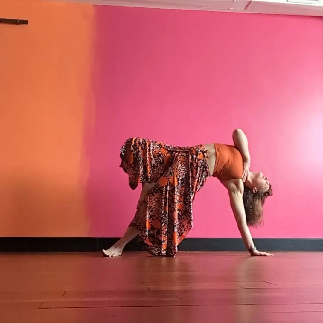 a woman in a skirt and a tank top