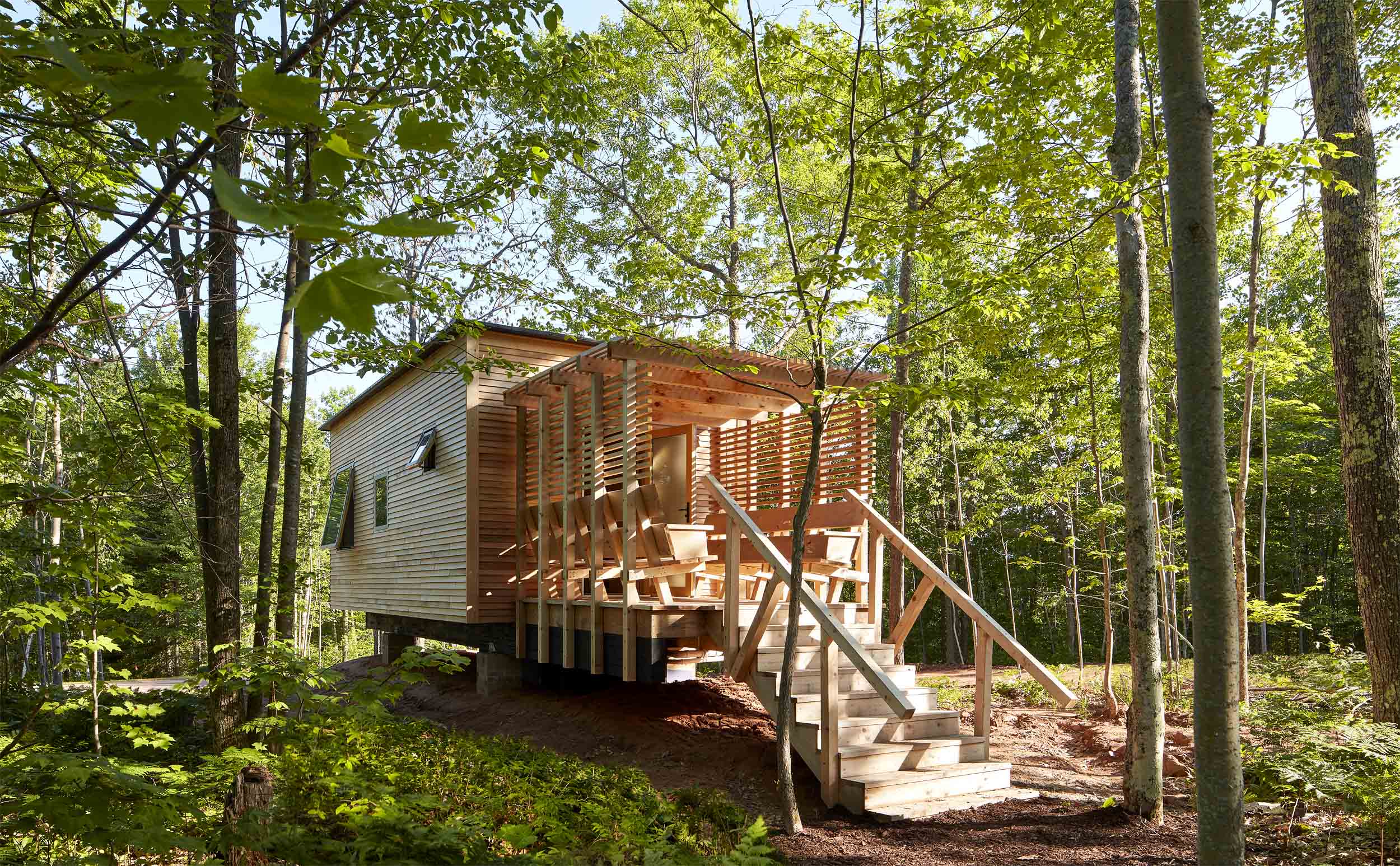 a wooden house in the woods