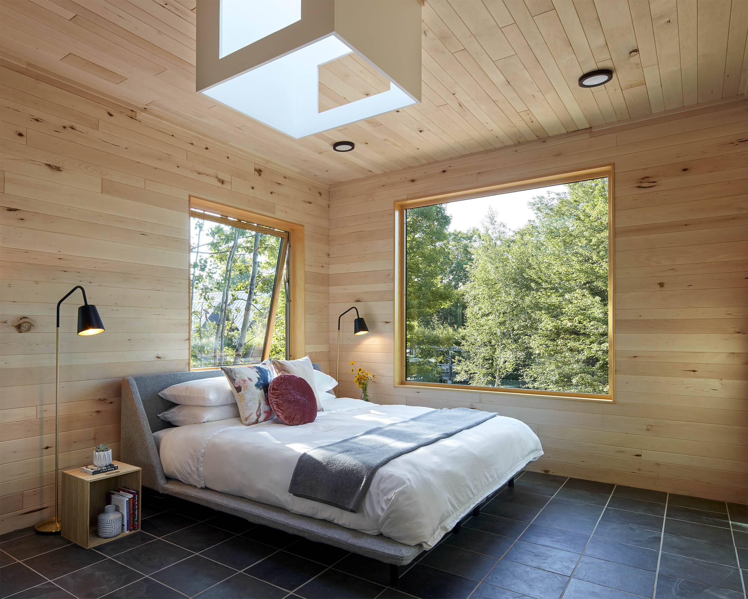 a bedroom with a large window